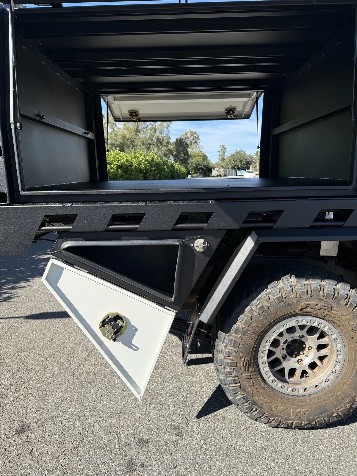 Rear of a black canopy with pass-through window