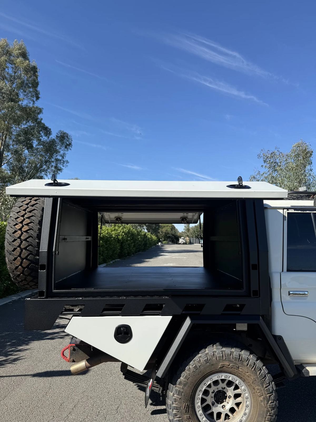 Canopy with side doors open showing through-access