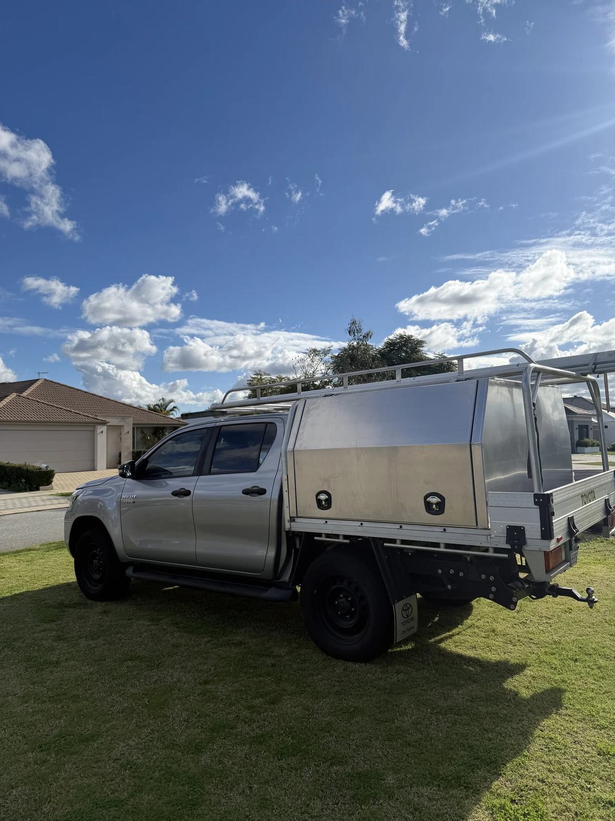 Silver Hilux dual cab with raw aluminium canopy