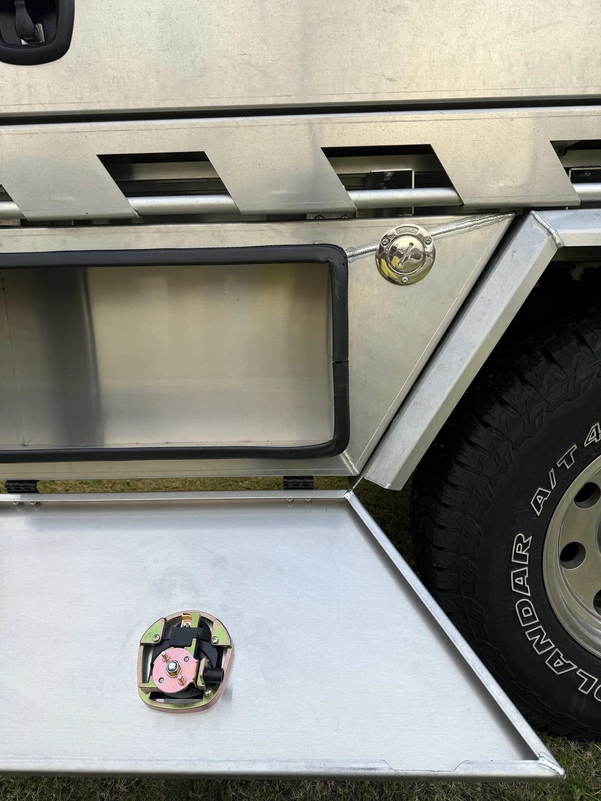 Close-up of an aluminium toolbox with a compression lock