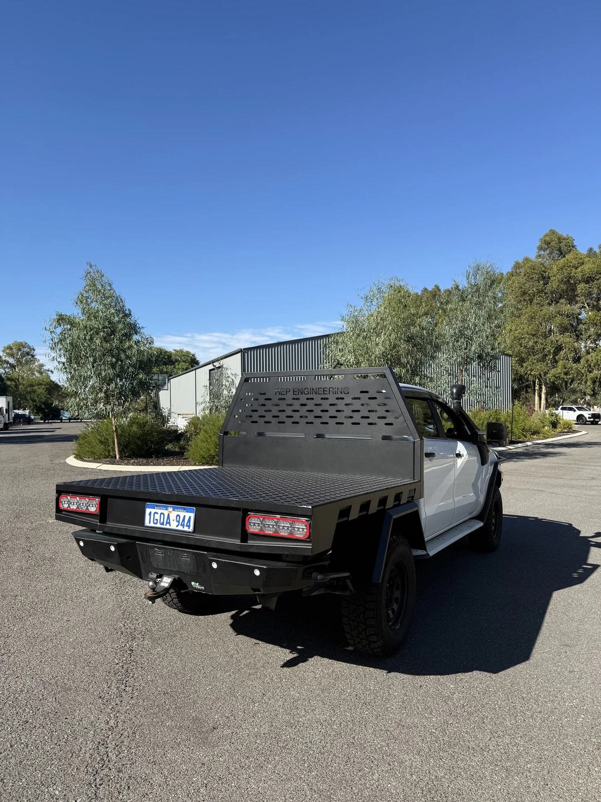 Black aluminium tray fitted to a Toyota Hilux